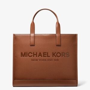 Women's handbag 👜  Cooper logo embossed pebbled leather tote bag .